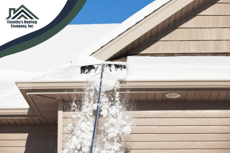 Springfield roofing professional safely removing heavy snow from a residential roof.
