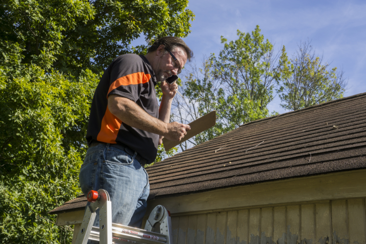 Timothy's Roofing Company conducting a roof inspection in Lorton.